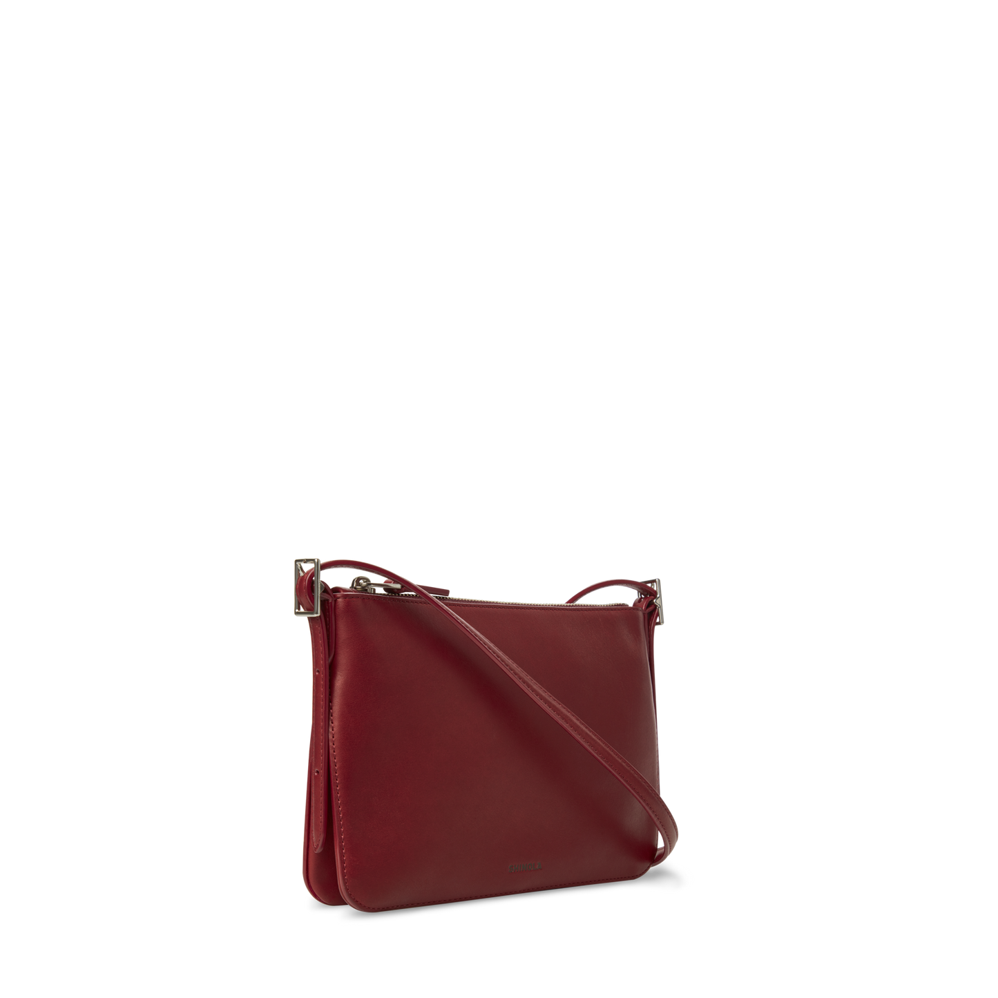 The Shinola Small Bixby Crossbody - Ruby features a sleek rectangular shape in dark red natural leather with a long adjustable strap and minimalist design—an ideal everyday accessory shown against a plain white background.