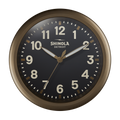 The 14" Shinola Runwell Clock features a round bronze frame, black face, and white numbers and hands, with "SHINOLA DETROIT" displayed at the center.