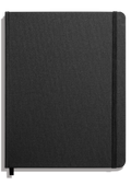 The Shinola Large Hard Plain Journal in black features a fabric-textured linen cover, acid-free pages, an elastic closure on the right edge, and a black ribbon bookmark. It is shown closed on a plain white background.