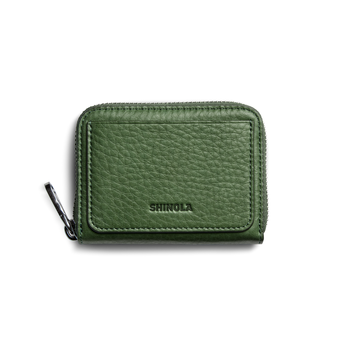 The Pocket Small Zip Around Wallet - Evergreen by Shinola is a compact, green grain leather wallet with a textured finish and “SHINOLA” embossed on the front, displayed against a plain white background.