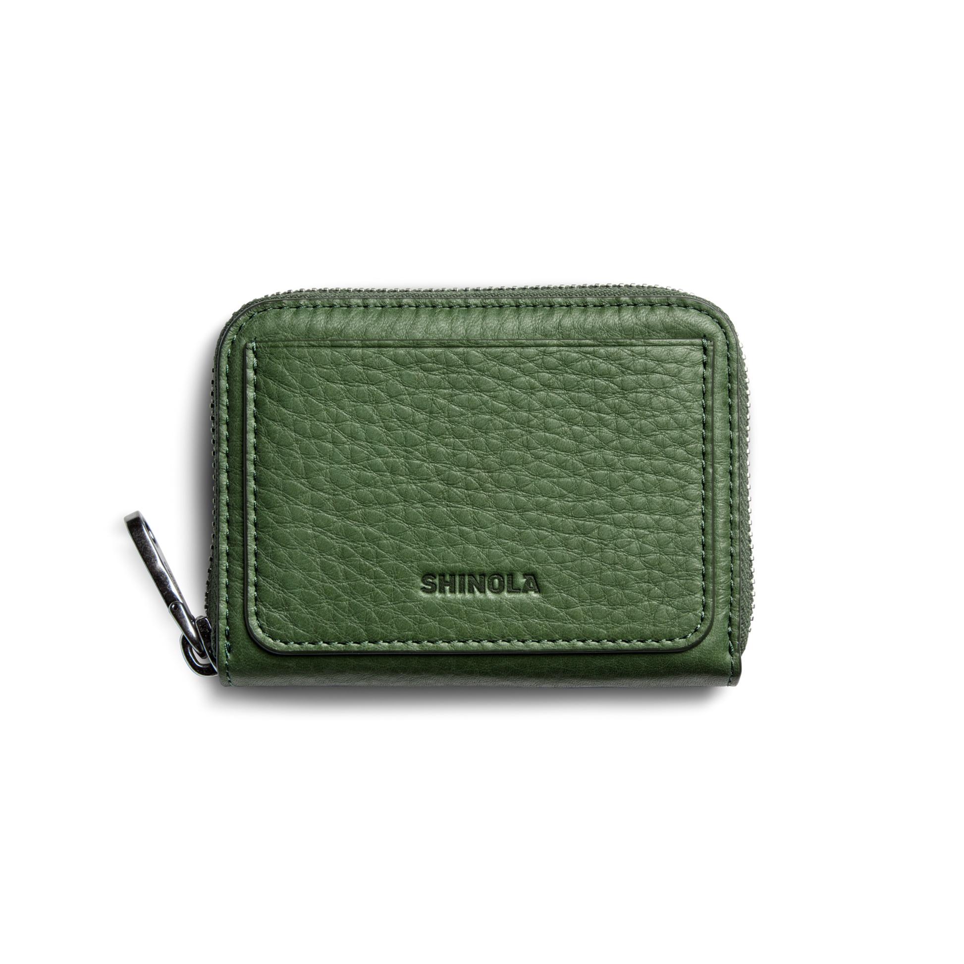 The Pocket Small Zip Around Wallet - Evergreen by Shinola is a compact, green grain leather wallet with a textured finish and “SHINOLA” embossed on the front, displayed against a plain white background.