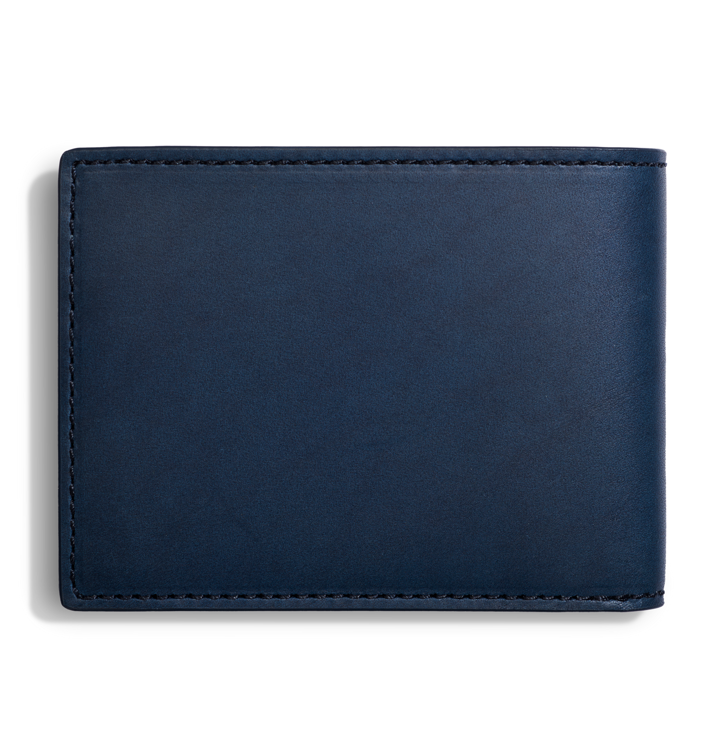 The Shinola Slim Bifold Wallet - Navy, crafted from leather and featuring visible edge stitching, is shown closed against a white background. This wallet combines style and convenience in a compact design.