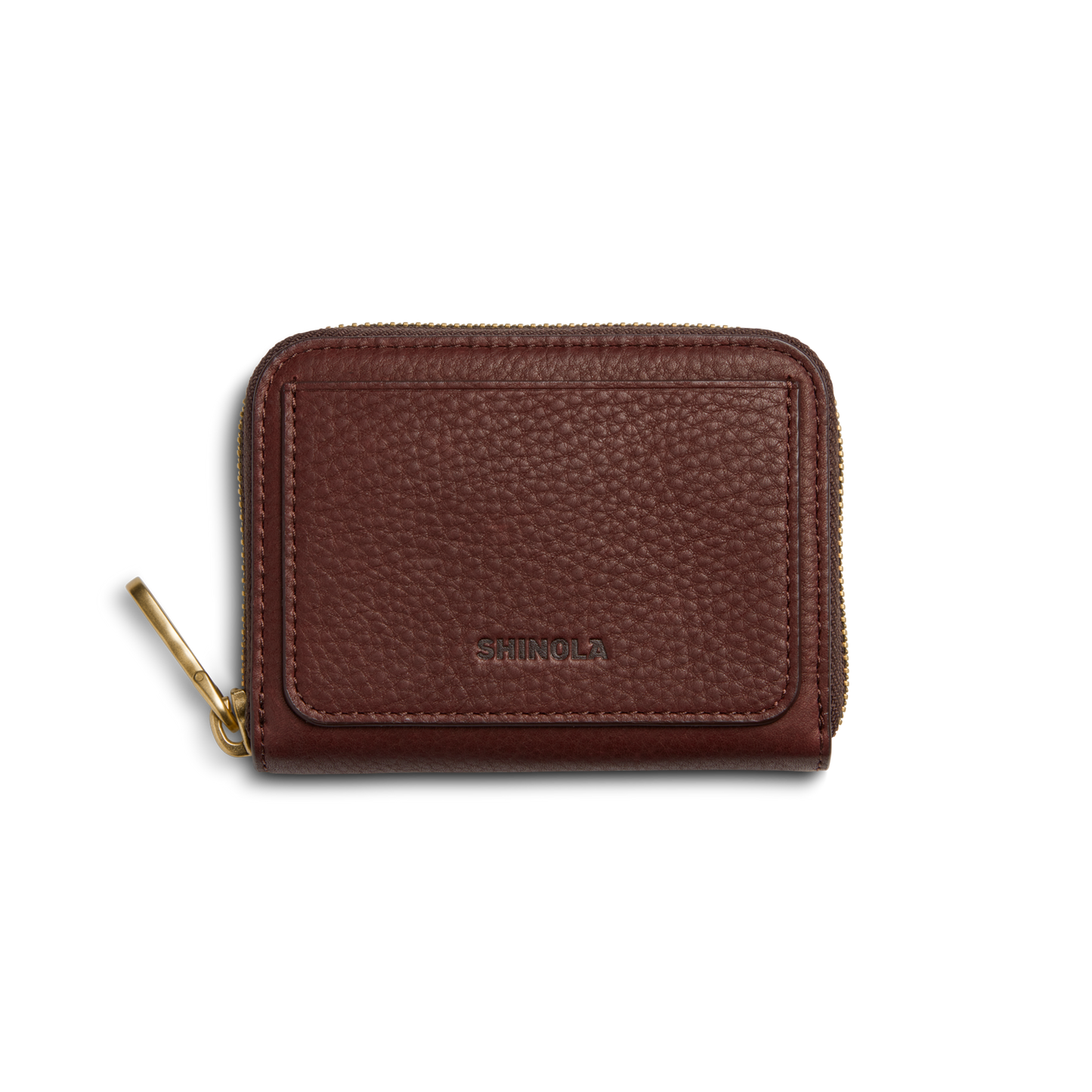The Shinola Pocket Small Zip Around Wallet in Merlot features textured brown leather, a gold zipper pull, and SHINOLA embossed on the front, displayed against a white background.