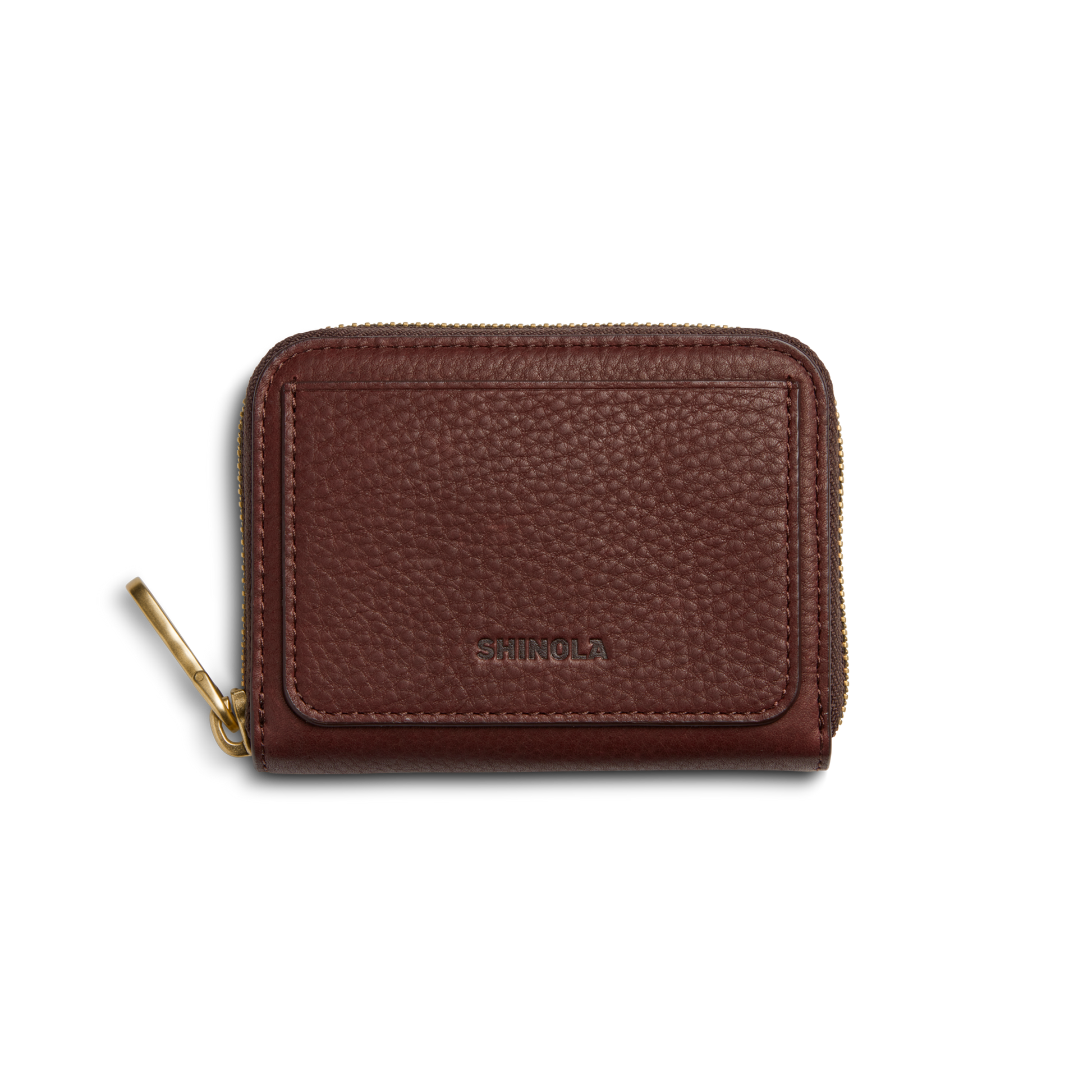The Shinola Pocket Small Zip Around Wallet in Merlot features textured brown leather, a gold zipper pull, and SHINOLA embossed on the front, displayed against a white background.