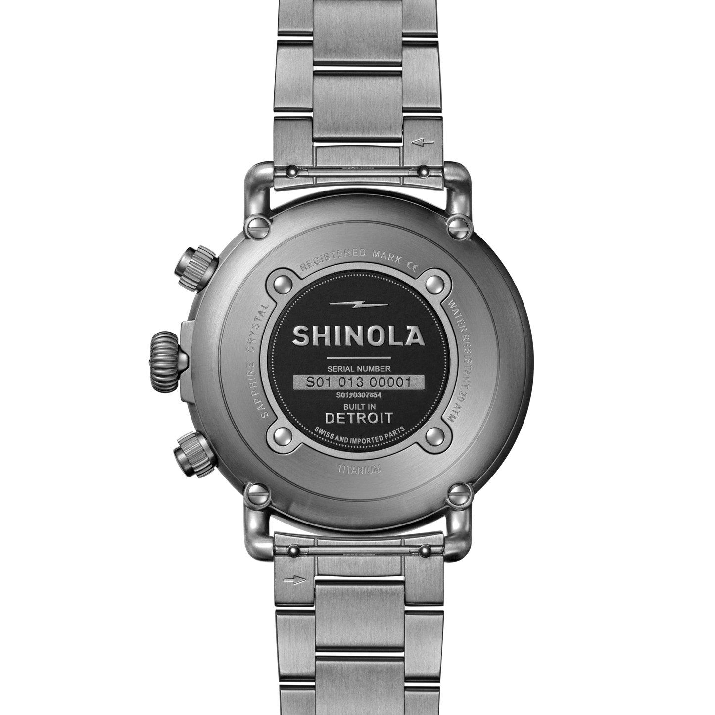 Back view of the Shinola Runwell Chronograph West Wind Watch Gift Set with Additional Strap – Black, showing the serial number, company logo, "Built in Detroit" engraving, 20 ATM mark on the case back, and attached metal link band.