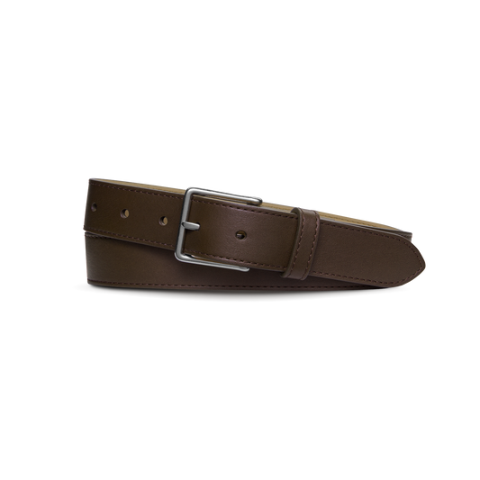 The Shinola 1 1/4" Dress Belt in brown is crafted from natural leather, features a silver rectangular buckle, and is shown coiled on a plain white background.