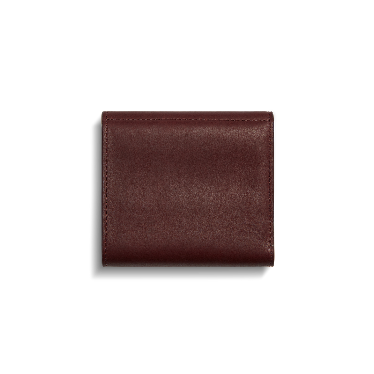 The Shinola Birdy Small Snap Wallet in Merlot is shown closed against a white background, highlighting its smooth leather finish and visible edge stitching.