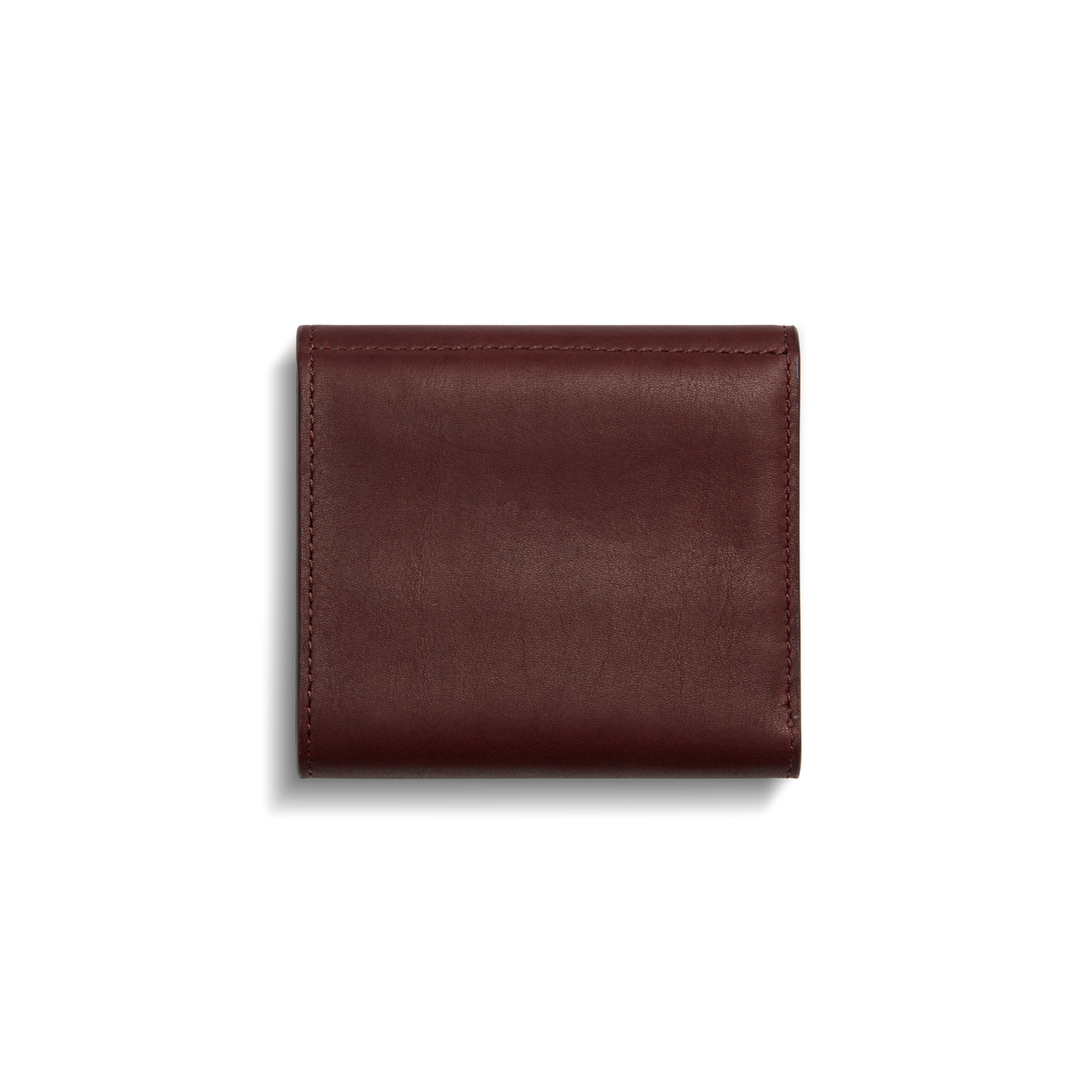 The Shinola Birdy Small Snap Wallet in Merlot is shown closed against a white background, highlighting its smooth leather finish and visible edge stitching.