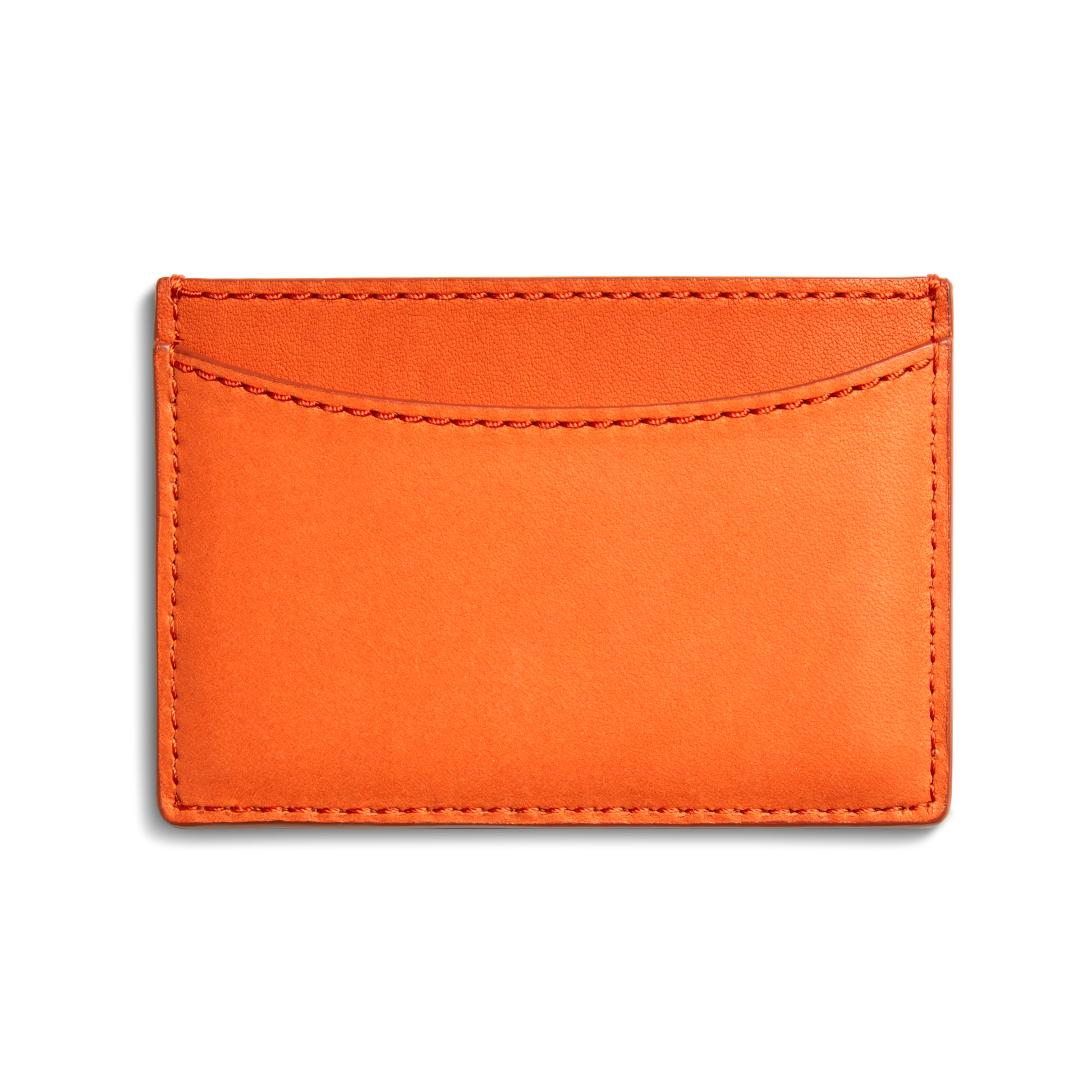 The Shinola Leather 3 Pocket Card Case in Tangerine is a slim, rectangular orange leather holder with visible stitching and one curved front pocket, shown against a plain white background.