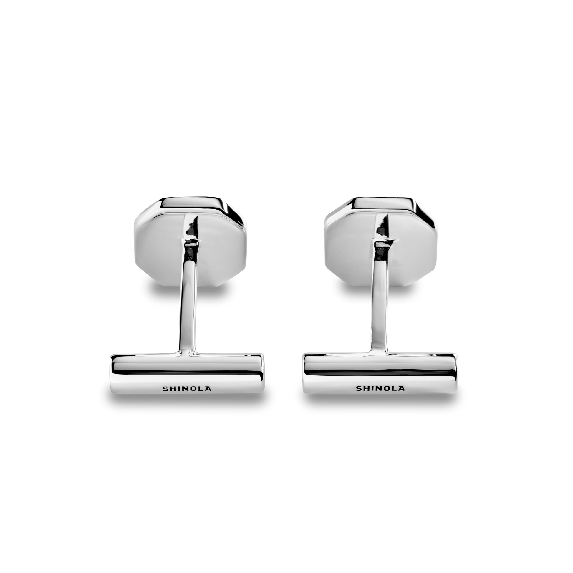 A pair of shiny Shinola Octagonal Cufflinks with hexagonal backs and cylindrical fronts engraved with "SHINOLA," shown against a plain white background.