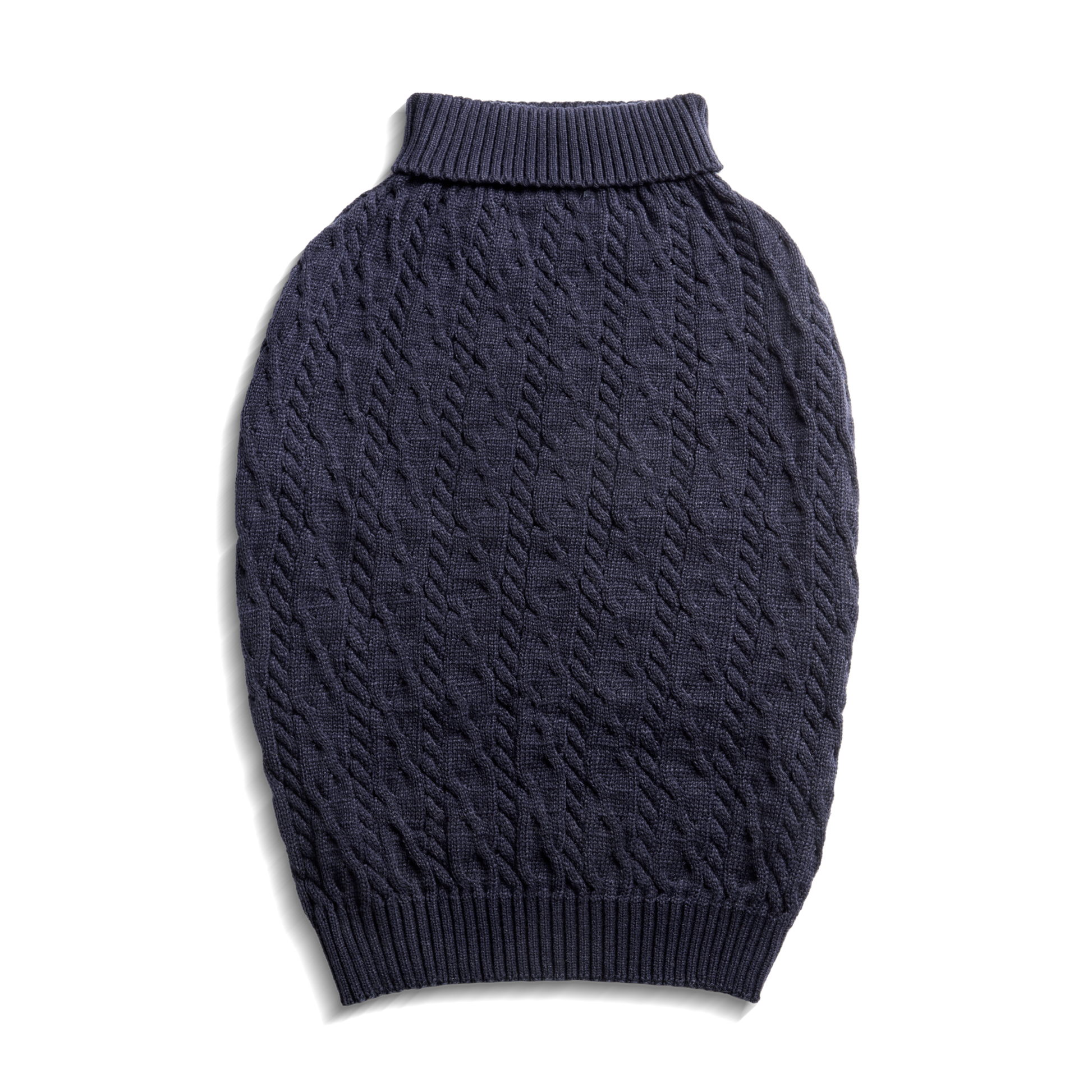 The Shinola Cable Knit Dog Sweater in ivory features a high ribbed neck and textured pattern, designed for pets. The pullover sweater is shown laid flat on a white background, highlighting its oval shape.