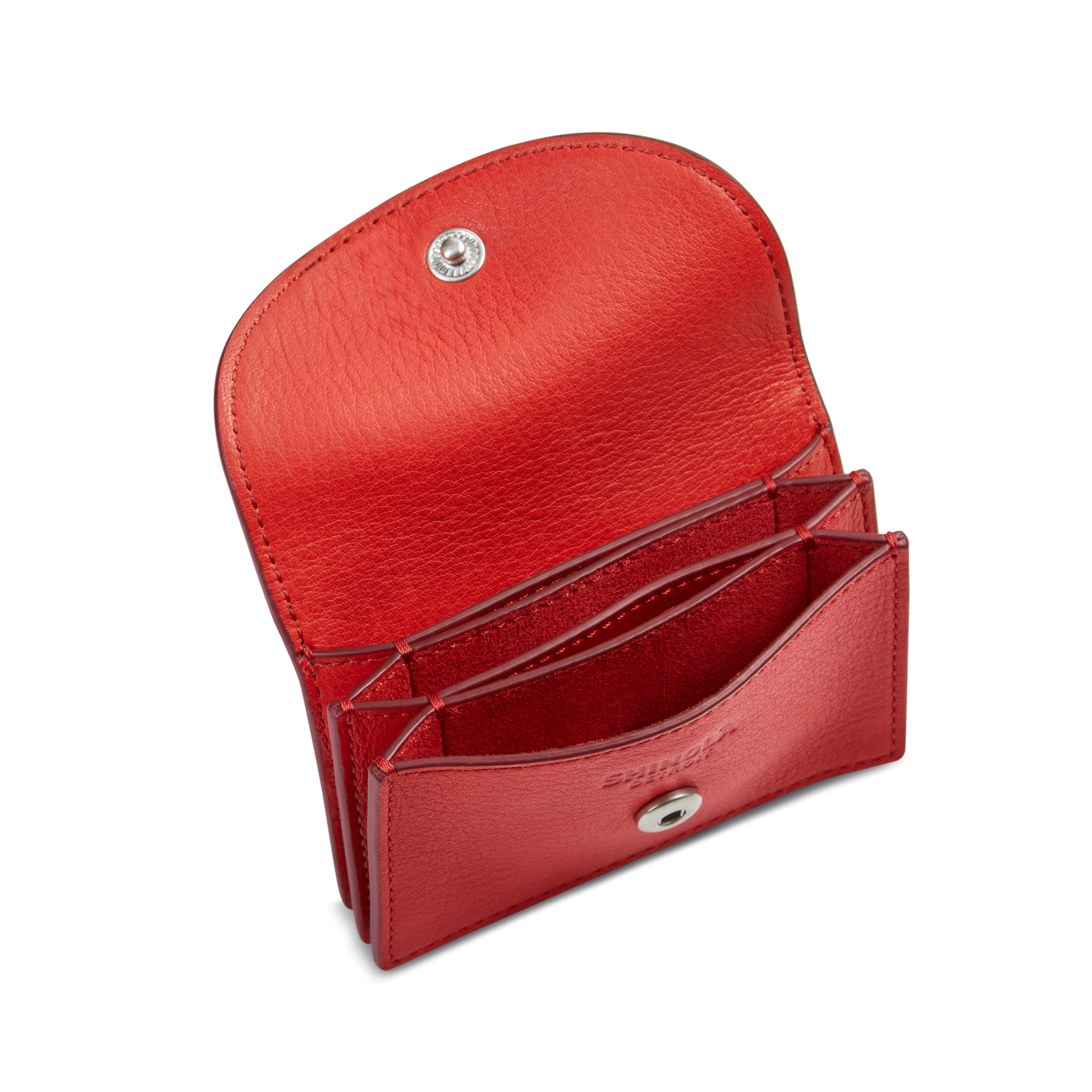 The Shinola Birdy Accordion Card Holder - Tomato is a red leather wallet with a flap open, multiple card pockets, silver snap button closure, textured red interior, and an elegant design.
