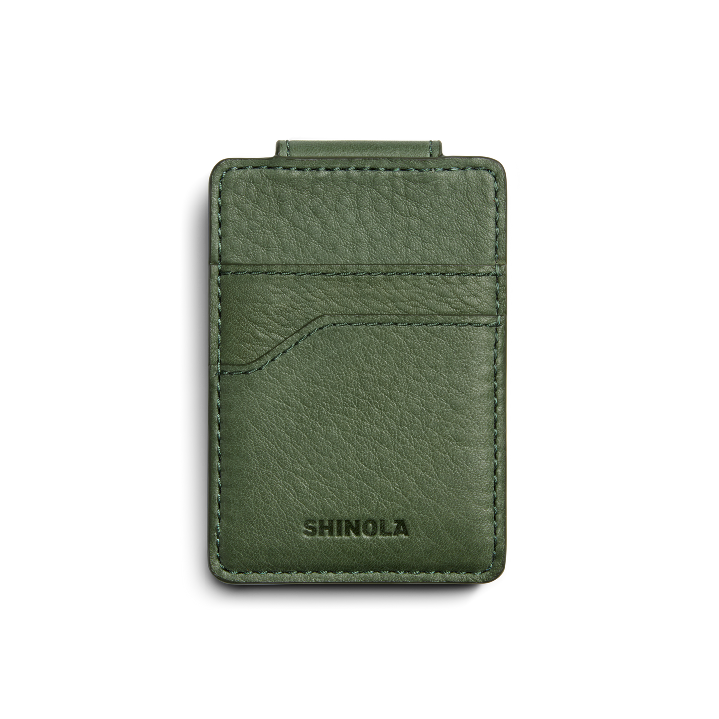 The Magnetic Money Clip Card Holder - Evergreen by Shinola is a green leather card holder with visible stitching, a front curved pocket, RFID-blocking technology, and an embossed logo at the bottom. Shown on a white background.
