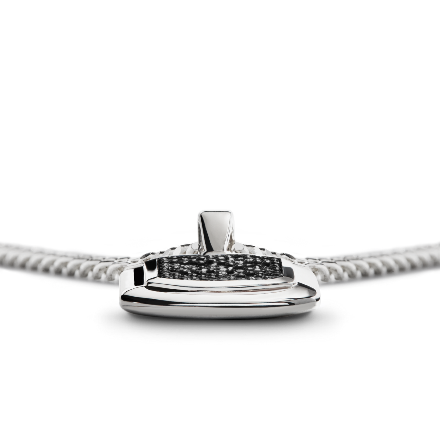 Close-up of the Shinola Black Diamond Pave Tag Necklace, a sterling silver piece with a rectangular pendant featuring black diamonds at the center, shown on a white background.